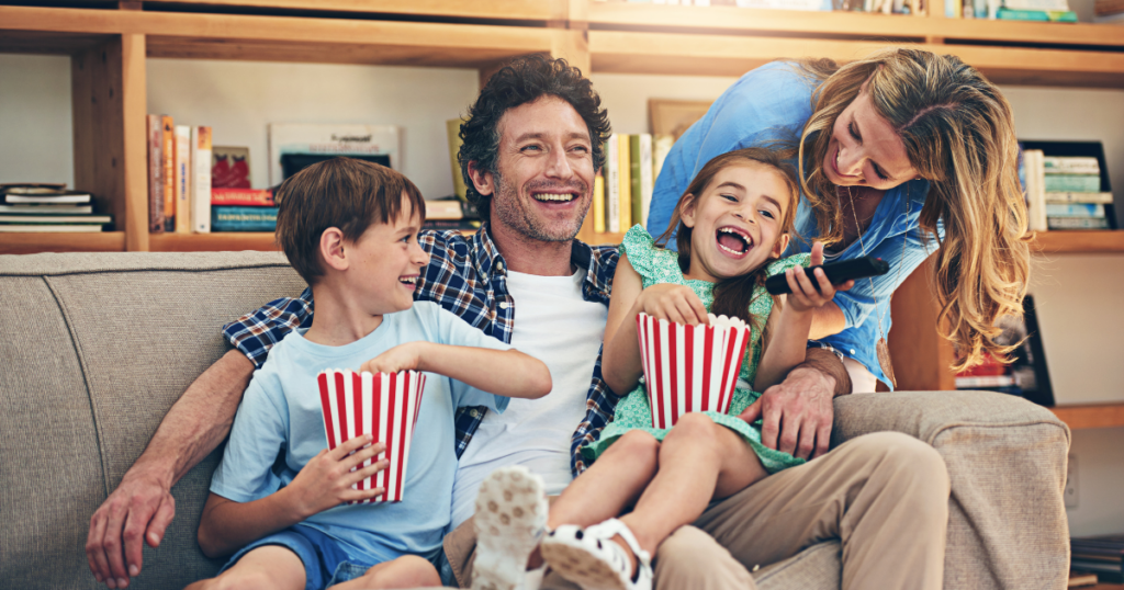 family watching movies eating popcorn