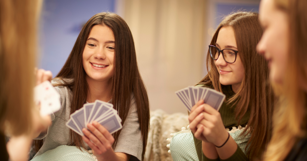 girls playing a card game