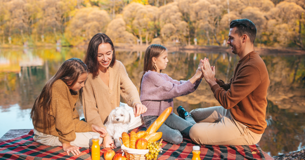 family having a picnic on a blanket